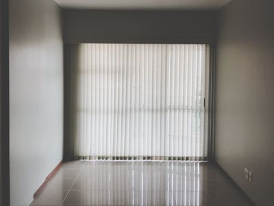 An empty, minimalist room with plenty of natural light.